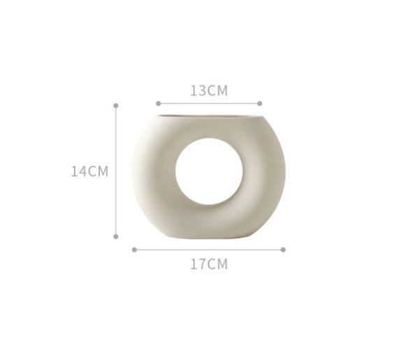 Minimalist Nordic decoration ceramic vase with matte glazed finish on white background