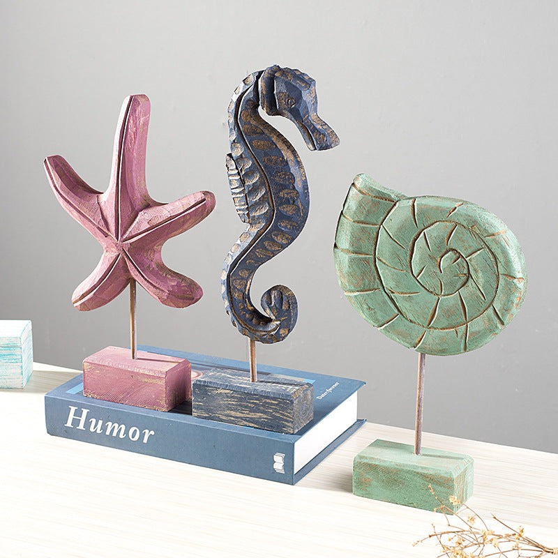 Coastal home decor featuring starfish, seahorse, and conch shell accents for living room display