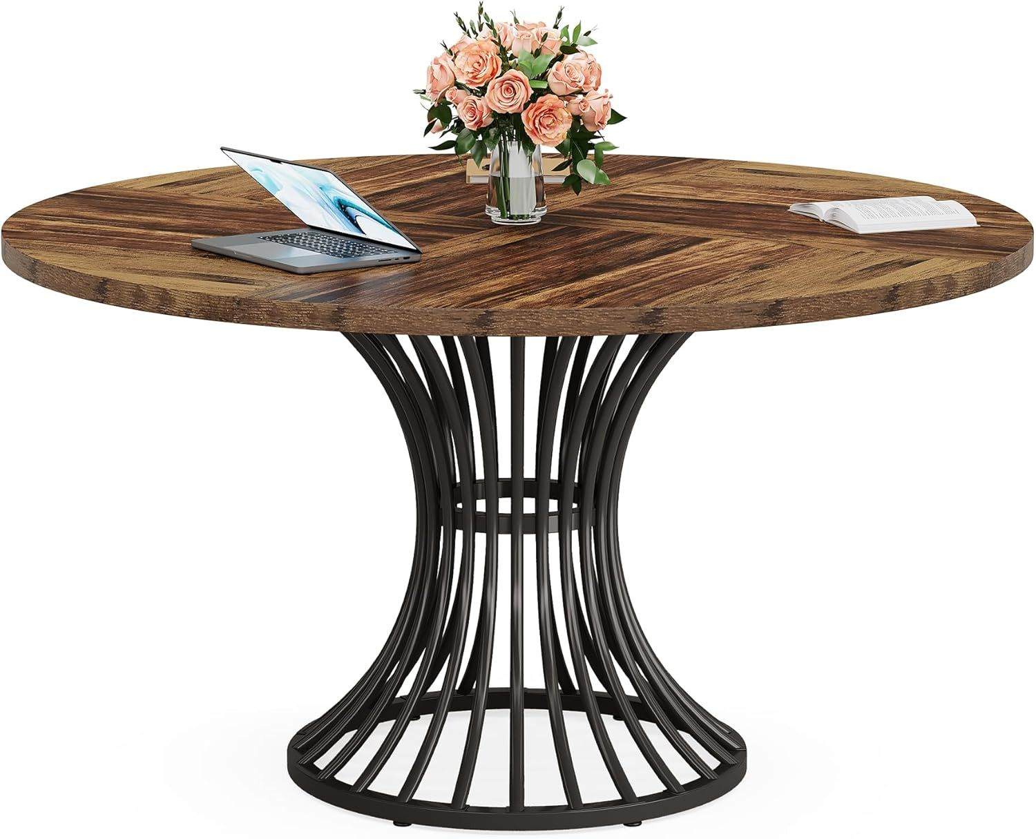 Stylish round dining table with wood grain MDF top and metal base designed for small spaces and social seating