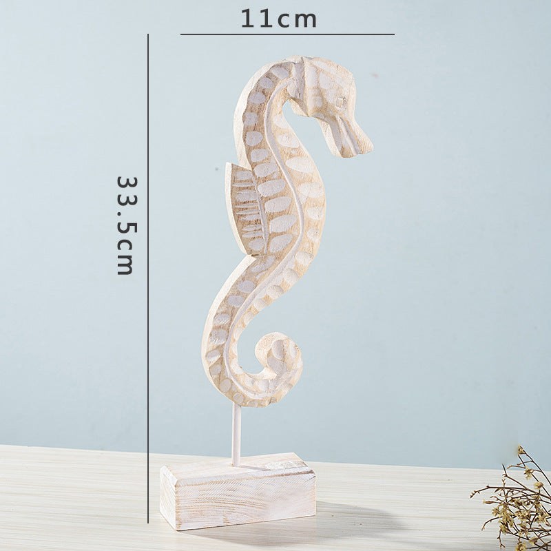 Coastal home decor featuring starfish, seahorse, and conch shell accents for living room display