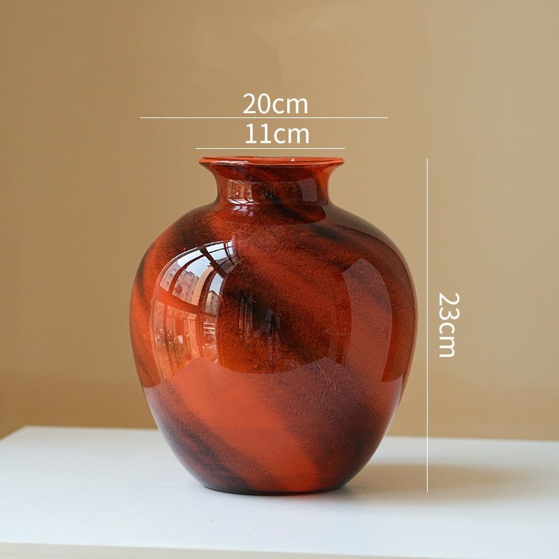 Clear lustrous glass vase with smooth polished finish and wide opening for floral arrangements