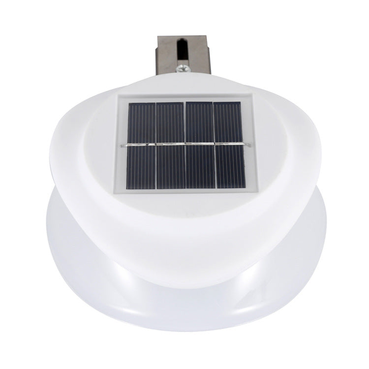 Modern outdoor fence wall lamp mounted on garden fence providing warm patio illumination