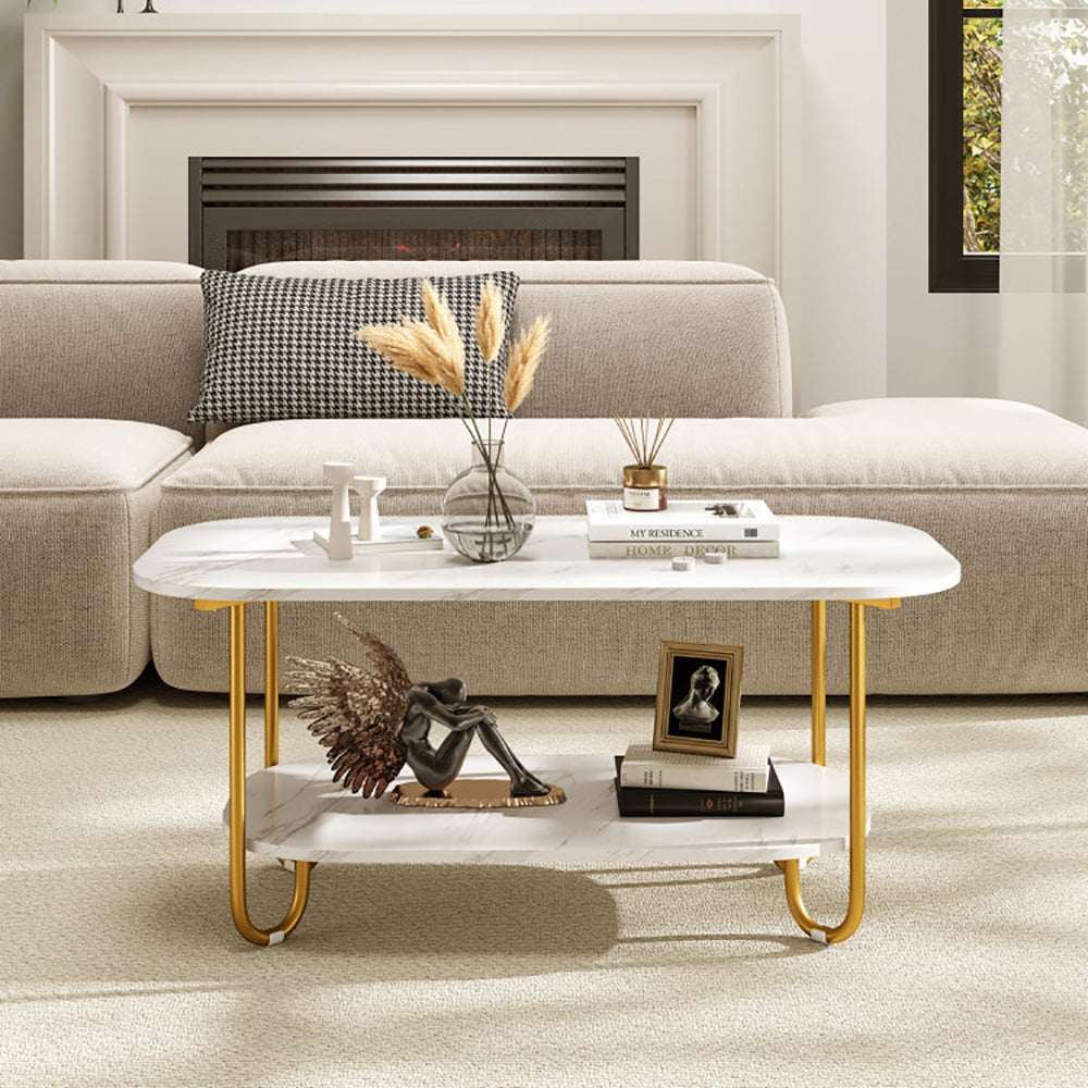 Modern 2-tier faux marble top coffee table with gold metal frame and lower shelf for storage in living room setting